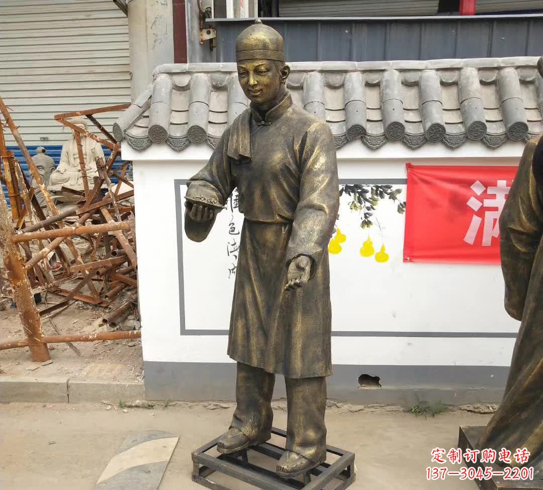 石狮传承百年店小二铜雕