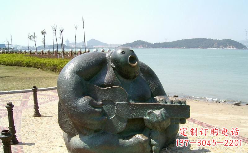 石狮音乐驻足,公园弹吉他铜雕