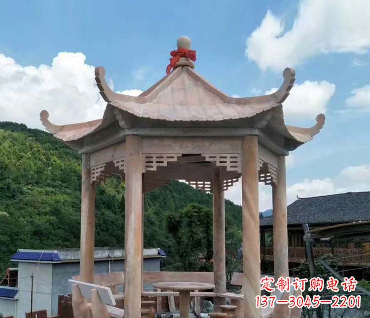 石狮一流的公园晚霞红六角石雕凉亭